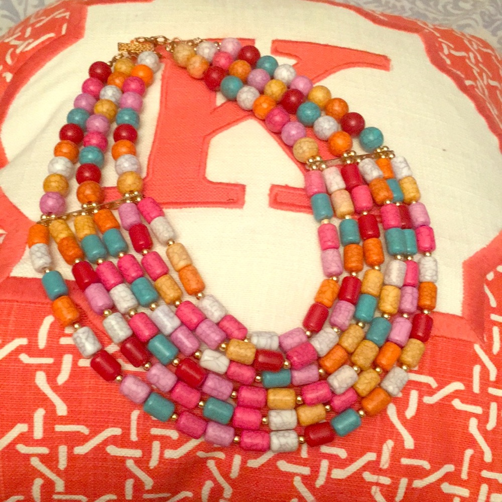 Beaded necklace, grey clutch, wide silver belt